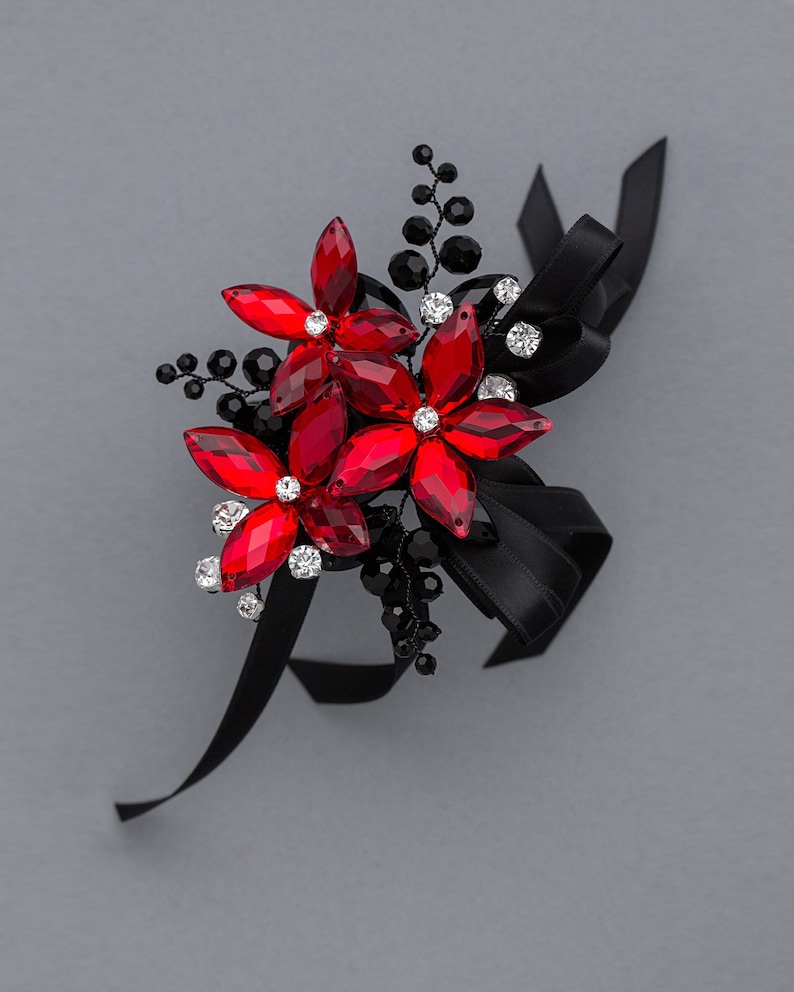 red and black wrist corsage for prom, homecoming, or weddings