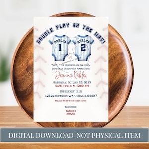 May include: Baseball-themed baby shower invitation with the text "DOUBLE PLAY ON THE WAY!" featuring two baby jerseys with the name "ROBLES" and numbers 1 and 2. The invitation includes event details and the text "DIGITAL DOWNLOAD-NOT PHYSICAL ITEM."