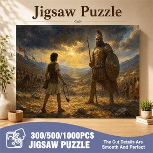 Op de afbeelding: Een legpuzzeldoos met een illustratie van een klein figuur met een slinger die tegenover een gigantische gepantserde krijger staat op een slagveld bij zonsondergang. De tekst luidt Jigsaw Puzzle, 300/500/1000PCS JIGSAW PUZZLE en The Cut Details Are Smooth And Perfect.