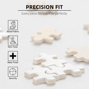 May include: Close-up of off-white puzzle pieces, some interlocked, with the text "PRECISION FIT" and "Every piece fits together perfectly." Icons indicate wood fabric, non-toxic, wear-proof, and security features.