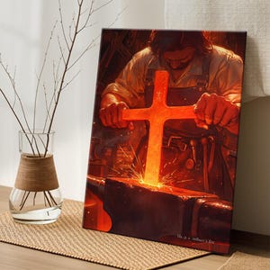 May include: A canvas print depicts a blacksmith forging a glowing red cross on an anvil. The scene is illuminated with fiery light and sparks. The text "He is a refiner's fire" is visible at the bottom right.