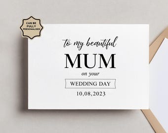 Peut inclure: Une carte de vœux rectangulaire blanche avec le texte noir : to my beautiful MUM on your WEDDING DAY 10,08,2023. Un badge beige dans le coin supérieur gauche contient le texte noir : CAN BE FULLY PERSONALISED. La carte est placée près d'une enveloppe.