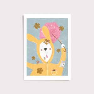Peut inclure: Une illustration num&eacute;rique repr&eacute;sentant un lapin blanc v&ecirc;tu d'un imperm&eacute;able jaune &agrave; capuche, tenant un parapluie rose &agrave; pois sur un fond bleu avec des feuilles d'automne. Un petit escargot est sur la capuche et une coccinelle est dans la poche.