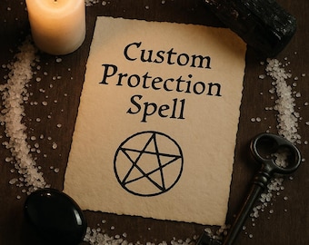 May include: A lit candle, a key, and a black stone are arranged around a parchment with the words "Custom Protection Spell" and a pentagram. White salt crystals form a circular border on a dark wooden surface.