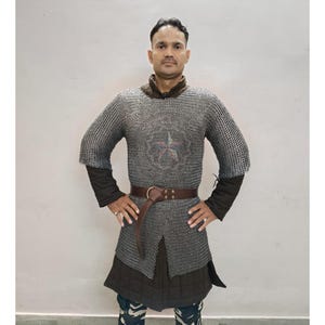 Detailed view of chainmail hauberk sleeve with riveted mild steel rings for durability and historical accuracy