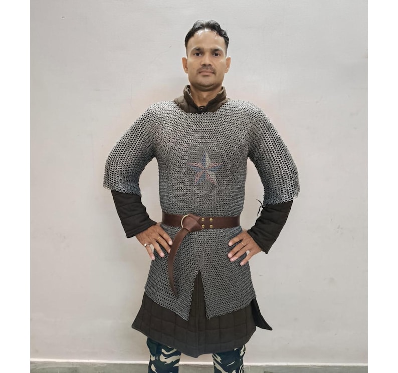 Detailed view of chainmail hauberk sleeve with riveted mild steel rings for durability and historical accuracy
