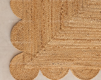 Könnte beinhalten: Ein natürlicher Jute-Teppich mit einem gewellten Rand. Der Teppich hat eine hellbraune Farbe und eine gewebte Textur. Der Text "Greatthandloom" ist auf dem Teppich aufgedruckt.