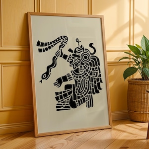 May include: A framed wall art print featuring a black graphic illustration of an ancient deity figure holding a serpent on a light beige background. The artwork is encased in a simple light-coloured wooden frame, displaying intricate patterns.