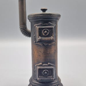 Vintage Playme pencil sharpener cast iron wood stove miniature collectible made in Spain 1970s retro desk decor fun for grown up children