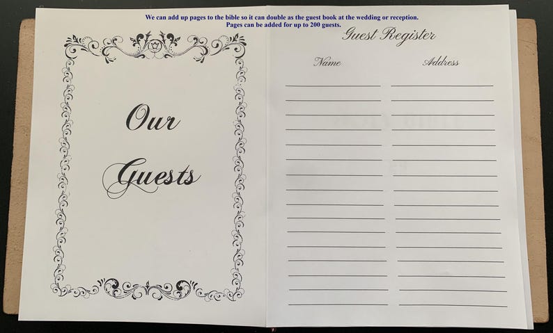 May include: A white guest book with a decorative border and the text "Our Guests" on the front cover. The back cover has a guest register section with columns for name and address.