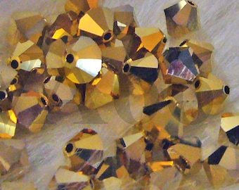 Swarovski Bicone 5328 Aurum 6mm Crystal AB 2x 5301 Gold Bead Lose Perlen für die Schmuckherstellung Gold Double Coated Kristalle Doppelkegel