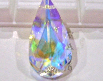 May include: A teardrop-shaped crystal with iridescent rainbow colors, reflecting light in shades of blue, green, and purple.