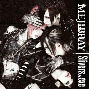 May include: Album cover featuring three individuals with dramatic makeup and hairstyles. The image is predominantly black and white with accents of pink. The text "MEJIBRAY | Singers x Gxe" is visible on the right side of the cover.