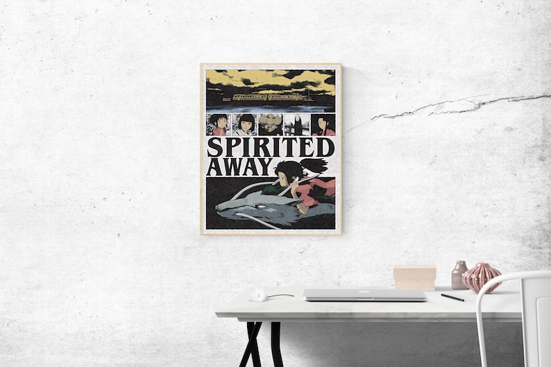 May include: A framed poster featuring the animated film "Spirited Away." The poster has a beige border and displays the film's title in large, bold letters. The artwork includes character illustrations and a scene of a girl riding a dragon.