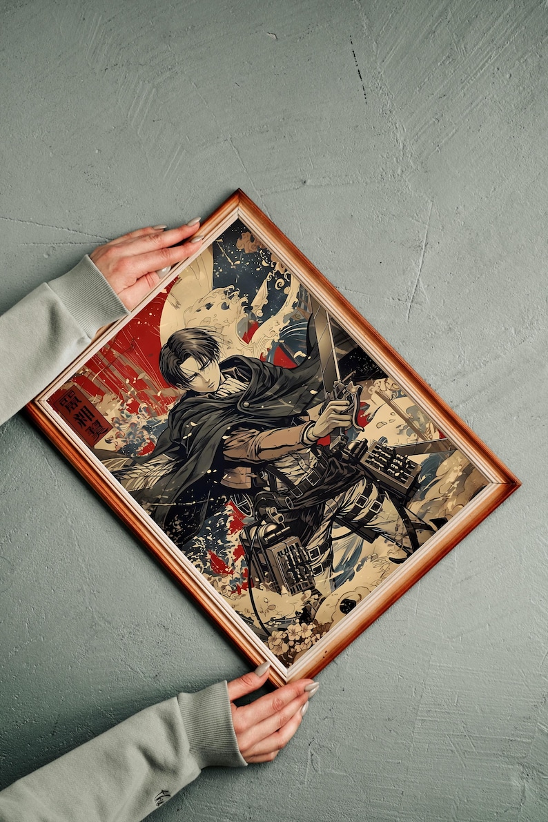 May include: Framed artwork featuring a character from the anime series Attack on Titan. The illustration depicts a person in a black cloak holding a sword, with a dynamic background of red, white, and blue elements. The frame is a warm brown color.
