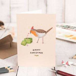 Biglietto di auguri di buon Natale con Robin e verme
