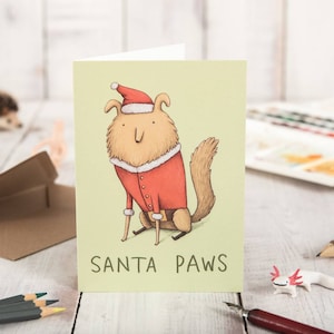 Cartolina di Natale con cane carino di Santa Paws