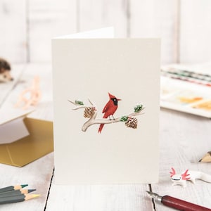Carte de Noël Cardinal sur branche