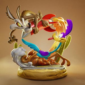 May include: A detailed figurine featuring Wile E. Coyote riding a red rocket with a yellow flame trail, chasing the Road Runner. The Road Runner is blue and purple, running across a desert road base with green cacti and a cloud of dust.