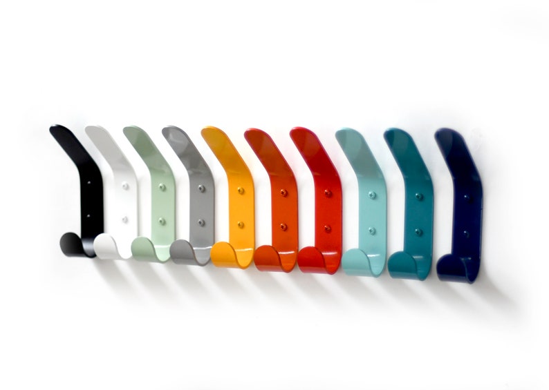May include: A set of 10 colorful metal hooks in various shades of blue, green, yellow, orange, and red. The hooks are all the same shape and size, and they are arranged in a row on a white background.
