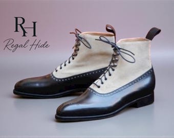 May include: Two-tone leather boots with a cream suede upper and black leather lower. The boots feature a lace-up design and pull tabs. The text "RH Regal Hide" is in the upper left corner.