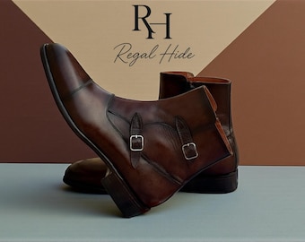 May include: Brown leather ankle boots with silver buckles. The boots have a pointed toe and a side zip. The brand name "Regal Hide" is displayed in the background.