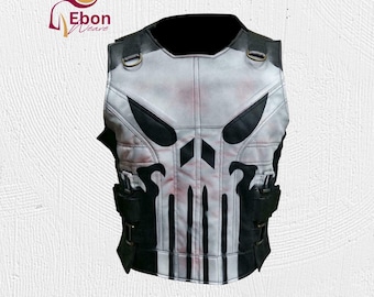 May include: A white and black vest with a skull design. The vest features black accents, including the skull's eyes and mouth, and black straps and pockets. The vest has a padded appearance and a black collar.