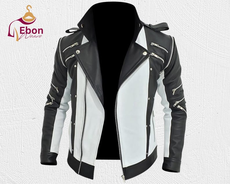 Peut inclure: Veste en cuir noir et blanc avec plusieurs fermetures &eacute;clair argent&eacute;es et un col montant. La veste pr&eacute;sente un design audacieux avec des panneaux contrast&eacute;s noirs et blancs, un v&ecirc;tement d'ext&eacute;rieur &eacute;l&eacute;gant.