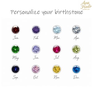 Może przedstawiać: Wykres zatytułowany Personalize your birthstone od Ava Halo Jewelry przedstawiający dwanaście okrągłych kamieni szlachetnych w r&oacute;żnych kolorach, z kt&oacute;rych każdy jest oznaczony skr&oacute;tem miesiąca od Jan. do Dec. Kamienie reprezentują kamienie urodzinowe.