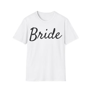 Bride Unisex Softstyle T-Shirt | Wedding Guest Gift, Bachelorette Party Tee, Future Mrs Shirt, Bridal Shower Outfit, Engagement [...]
