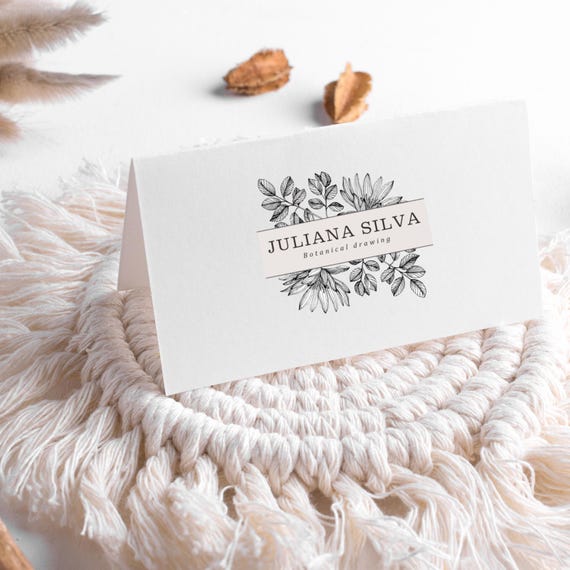 Beige and Black Floral Logo