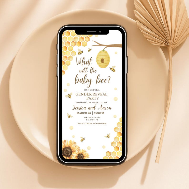 May include: A smartphone displays a baby gender reveal party invitation. The design features a honeycomb pattern, bees, and sunflowers. The text reads "What will the baby bee?" and includes the names Jessica and Aaron, along with the date and time.
