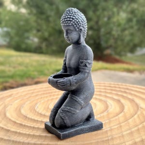 May include: A set of three ceramic mugs with a speckled, matte finish. The mugs are in shades of cream, light gray, and dark gray. Each mug has a simple, minimalist design and a rounded handle.