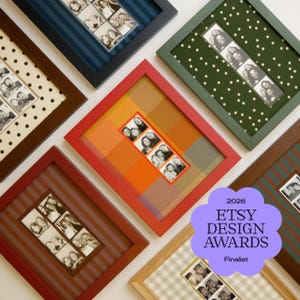 May include: A collection of rectangular picture frames in various colors including red, dark blue, green, and light wood, each containing a vertical strip of black and white photo booth portraits mounted on patterned backgrounds like polka dots and stripes.