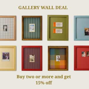 May include: Eight rectangular picture frames arranged in two rows, featuring various colors including light wood, dark wood, olive green, light blue, yellow, and red. The frames contain diverse backgrounds like gingham, stripes, and solid colors with photos.