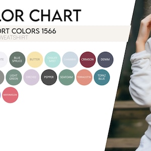 Puede incluir: Carta de colores para una sudadera unisex, con una paleta de 18 colores, incluyendo Azul Vaquero, Blanco y Crimson. El texto "COMFORT COLORS 1566" se muestra encima de las muestras de color. Una persona lleva una sudadera gris claro.