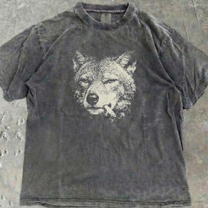 coyote chewing on a cigarette meaning Smoking Coyote