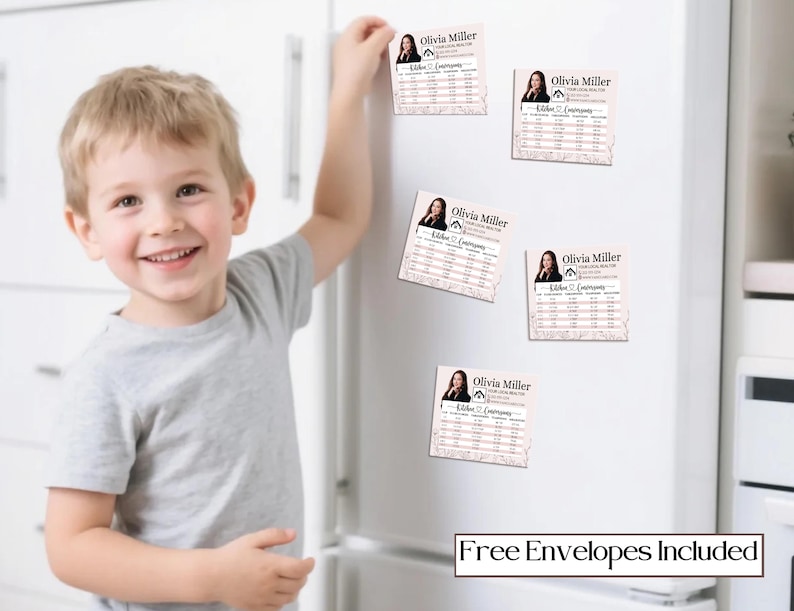 May include: A young child smiles while reaching for a magnet on a white refrigerator. The magnets feature a headshot of a woman and the text "Olivia Miller, Realtor." The phrase "Free Envelopes Included" is printed at the bottom.
