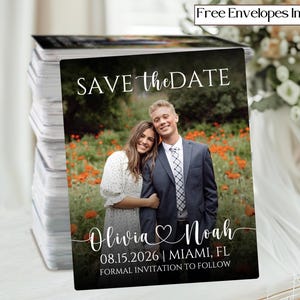 May include: A stack of save-the-date cards featuring a couple posing in a field of flowers. The cards have the text "SAVE the DATE", names, date, location, and "FORMAL INVITATION TO FOLLOW". The cards include free envelopes.