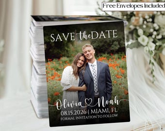 May include: A stack of save-the-date cards featuring a couple posing in a field of flowers. The cards have the text "SAVE the DATE", names, date, location, and "FORMAL INVITATION TO FOLLOW". The cards include free envelopes.
