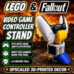 May include: A 6.5 inches tall video game controller stand featuring a white and black controller resting on a yellow, grey, and blue base. The text reads LEGO & Fallout, VIDEO GAME CONTROLLER STAND, FITS BOTH XBOX AND PLAYSTATION!, BUILT FOR GAMERS. MADE FOR FANS., 6.5 INCHES TALL, and UPSCALED 3D-PRINTED DECOR.
