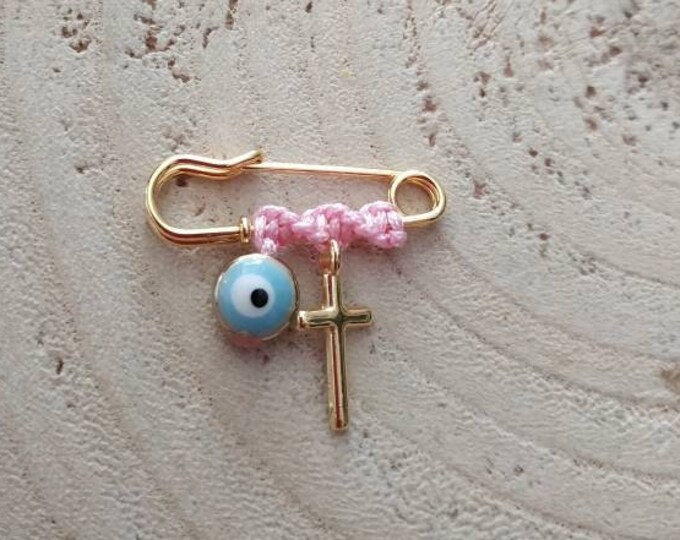 Mini slim cross brooch with light blue eye