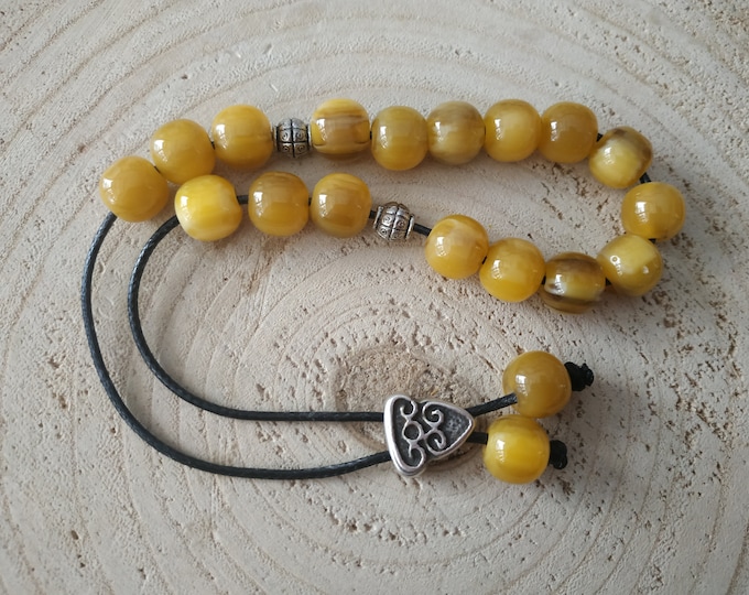 21 yellow resin worry beads