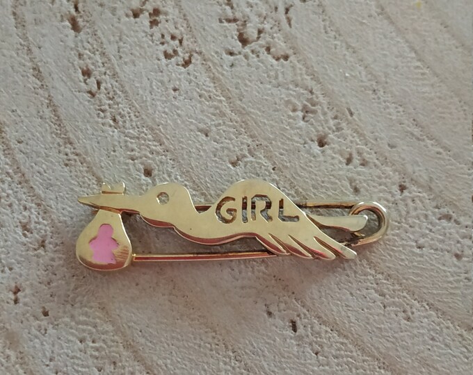 Pink stork carrying baby girl pin