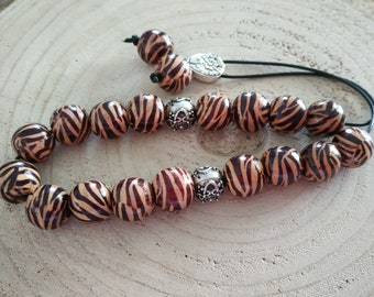 21 wooden animal print worry beads