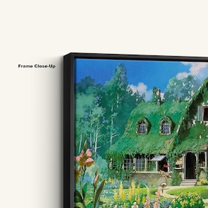 May include: Close-up of a framed canvas print featuring a vibrant illustration of a cottage with a green roof, surrounded by lush greenery and flowers. The sky is a bright blue. The text "Frame Close-Up" is visible on the frame.