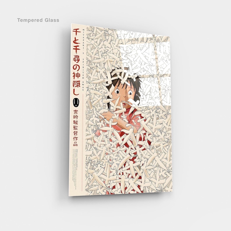 May include: Tempered glass art featuring a scene from the animated film "Spirited Away." The artwork depicts a young girl surrounded by white figures, with Japanese text on the side. The glass has a glossy finish.