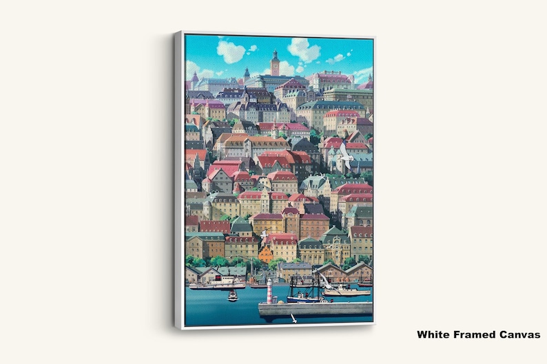 May include: A framed canvas print featuring a vibrant illustration of a European coastal town. The artwork showcases colorful buildings with red-tiled roofs, a harbor with boats, and a bright blue sky with fluffy clouds. The canvas is framed in white.