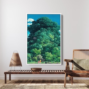 May include: A framed art print shows a vibrant green forest beneath a blue sky with white clouds. Two small figures are in a clearing, giving scale to the tall trees. The artwork is displayed on a white wall, creating a striking contrast.