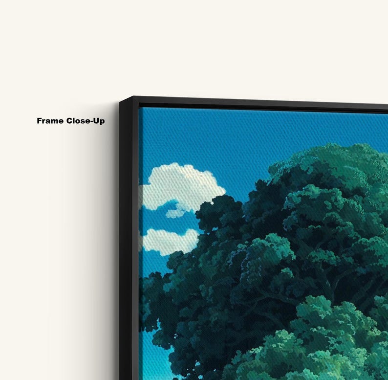 May include: Close-up of a framed canvas print showing a landscape scene. The artwork features a bright blue sky, white clouds, and green trees. The frame is black, and the text "Frame Close-Up" is visible.